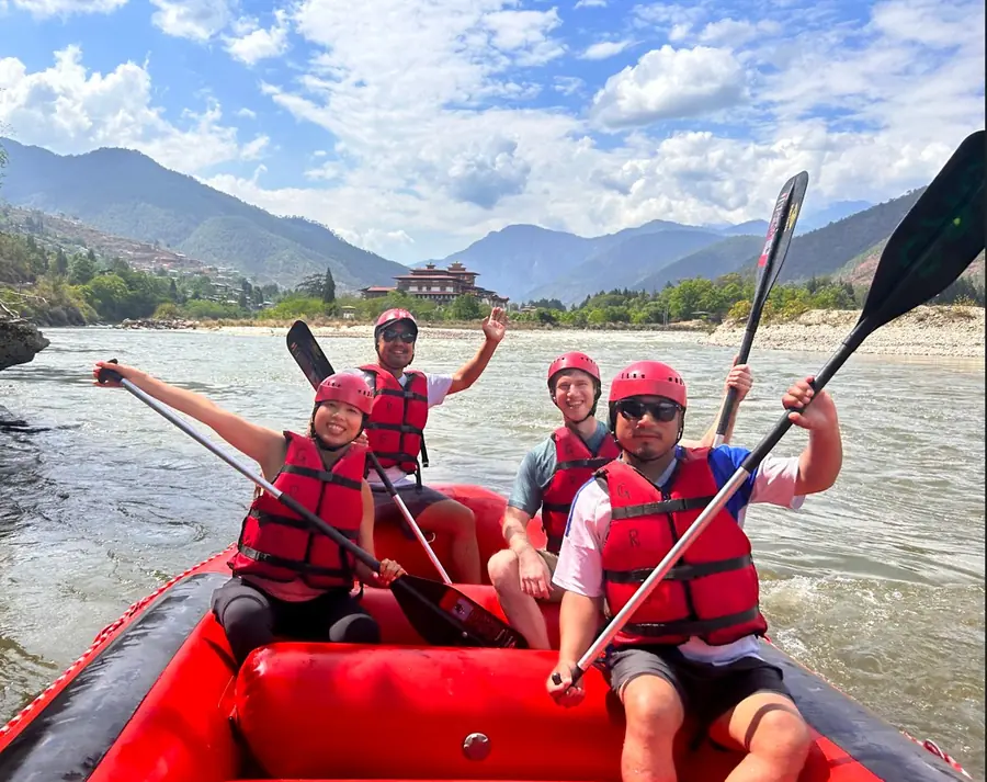 Travelers river rafting near Punakha Dzong, Bhutan